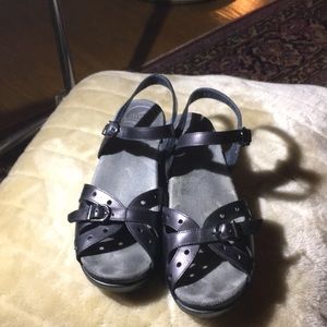 Black Dansko buckle sandals.